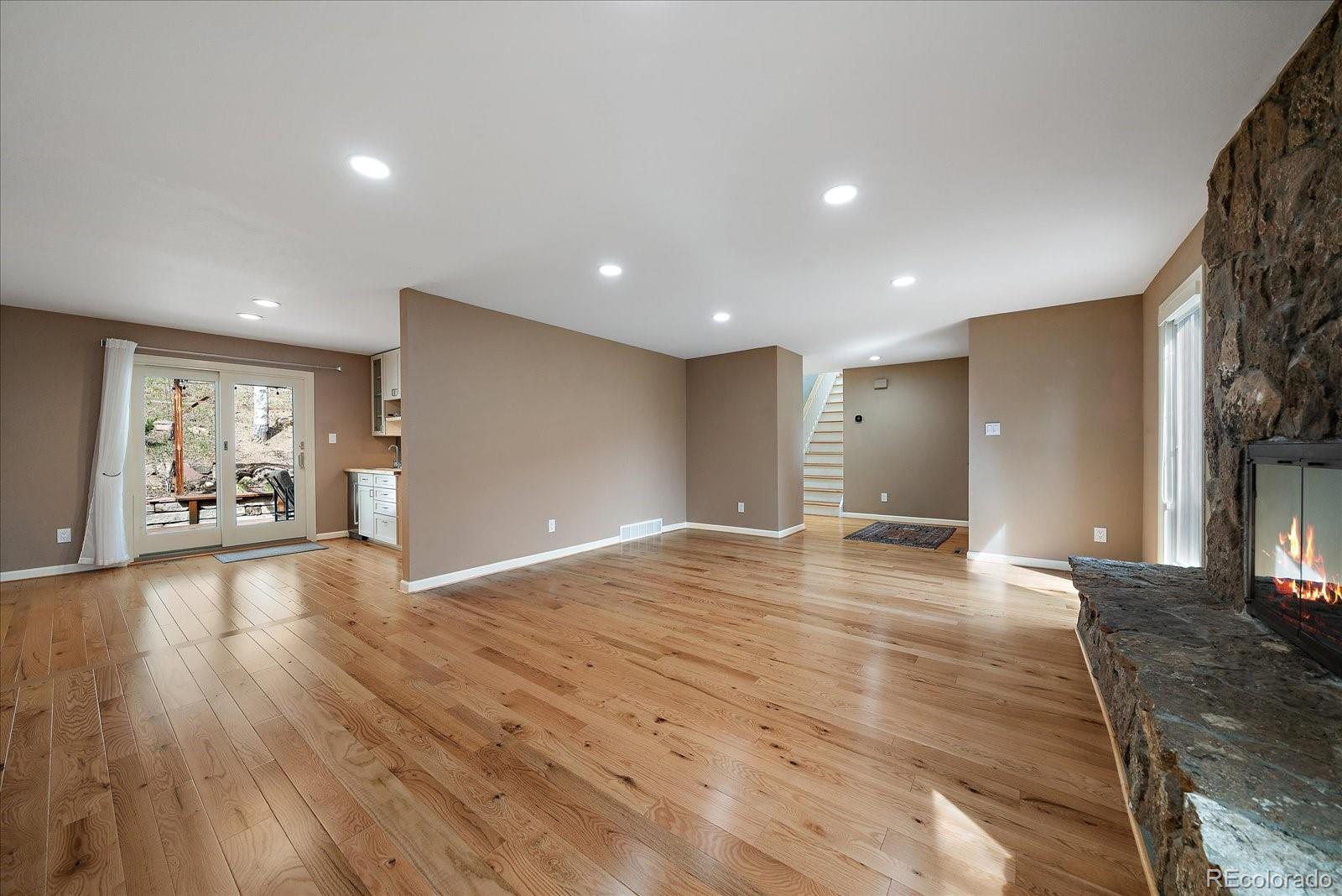 4039 Histead Way Evergreen, CO 80439 - Photo 11 of 48 a view of a livingroom with wooden floor