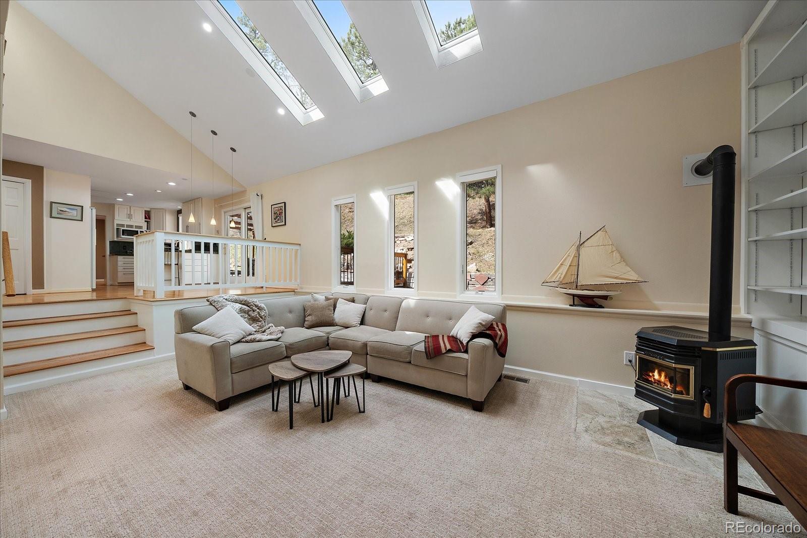 4039 Histead Way Evergreen, CO 80439 - Photo 23 of 48 a living room with furniture and a large window