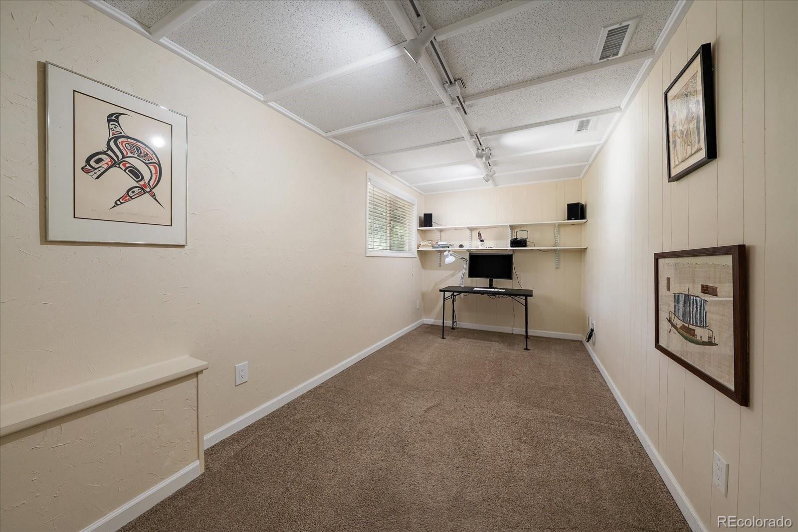 4039 Histead Way Evergreen, CO 80439 - Photo 25 of 48 a living room with furniture and white walls