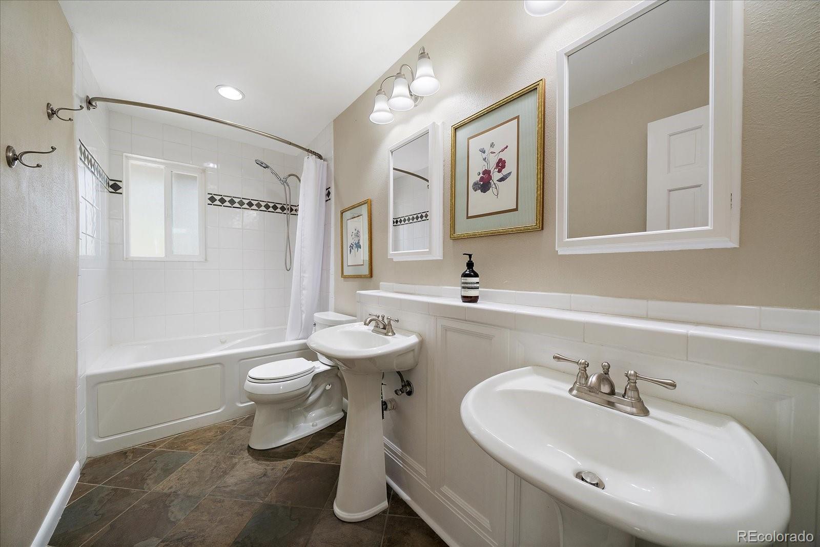 4039 Histead Way Evergreen, CO 80439 - Photo 33 of 48 a bathroom with a sink toilet and a mirror