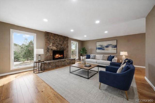 4039 Histead Way Evergreen, CO 80439 - Photo 8 of 48 a living room with furniture and a fireplace