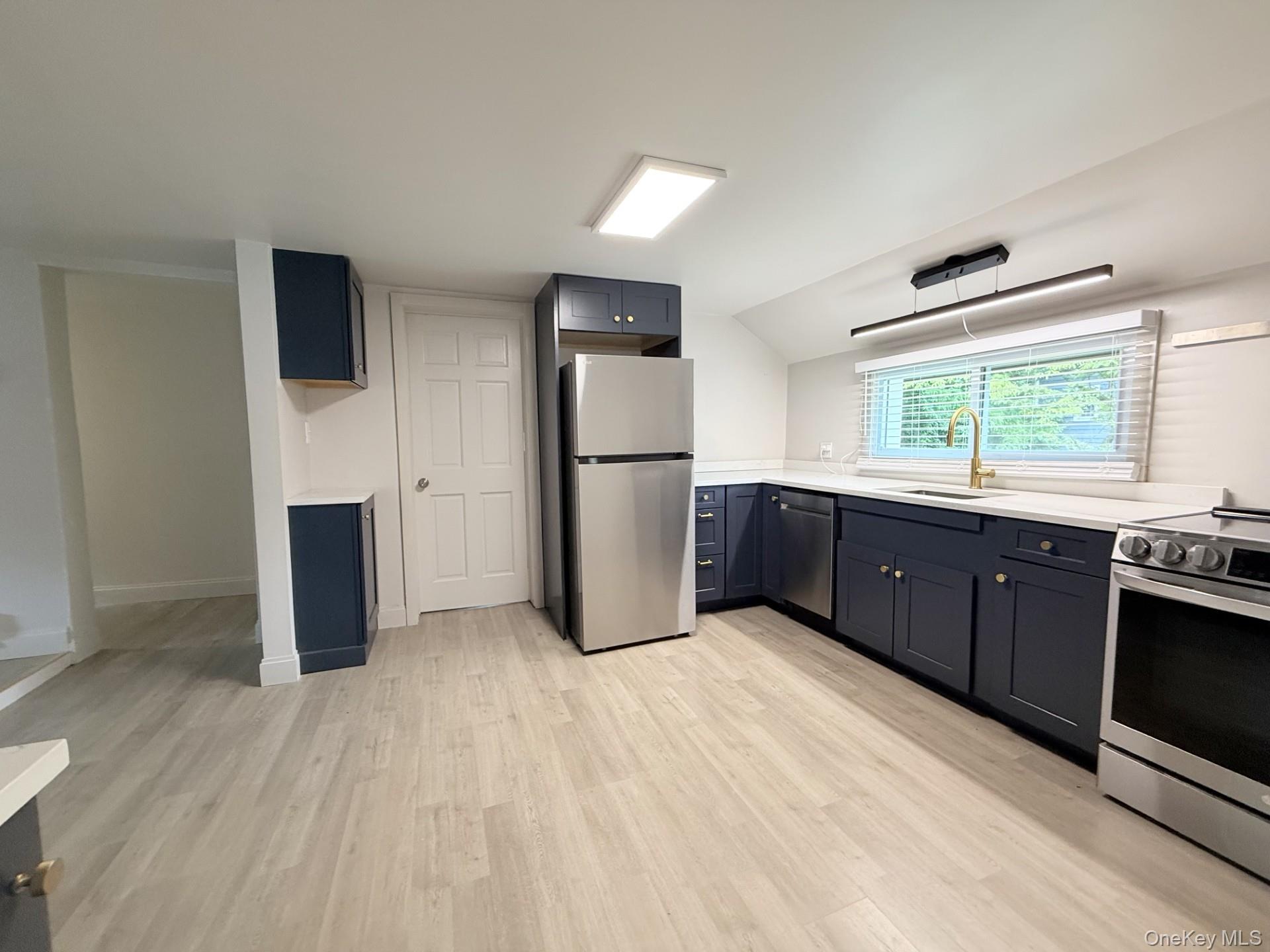 4 Lower Trinity Pass Road Pound Ridge, NY 10576 - Photo 21 of 29 a kitchen with stainless steel appliances kitchen island granite countertop a refrigerator and a stove top oven