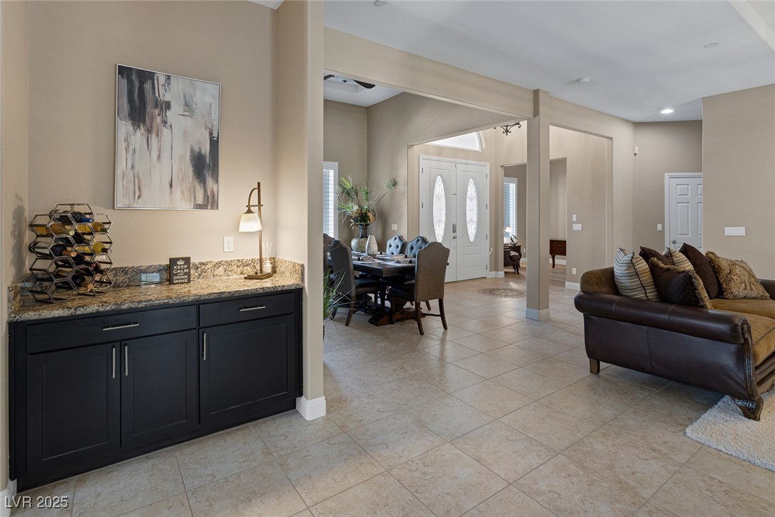 7687 West Pebble Road Las Vegas, NV 89113 - Photo 13 of 79 Living area with recessed lighting, light tile patterned floors, and baseboards