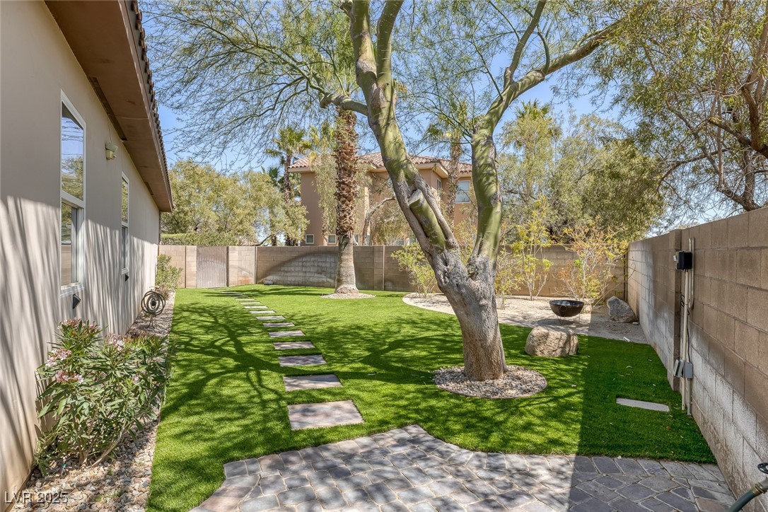 7687 West Pebble Road Las Vegas, NV 89113 - Photo 30 of 79 View of yard featuring a fenced backyard