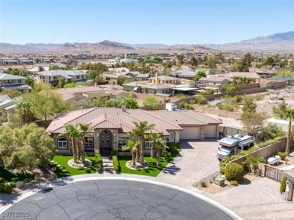 7687 West Pebble Road Las Vegas, NV 89113 - Photo 42 of 79 Drone / aerial view with a mountain view and a residential view