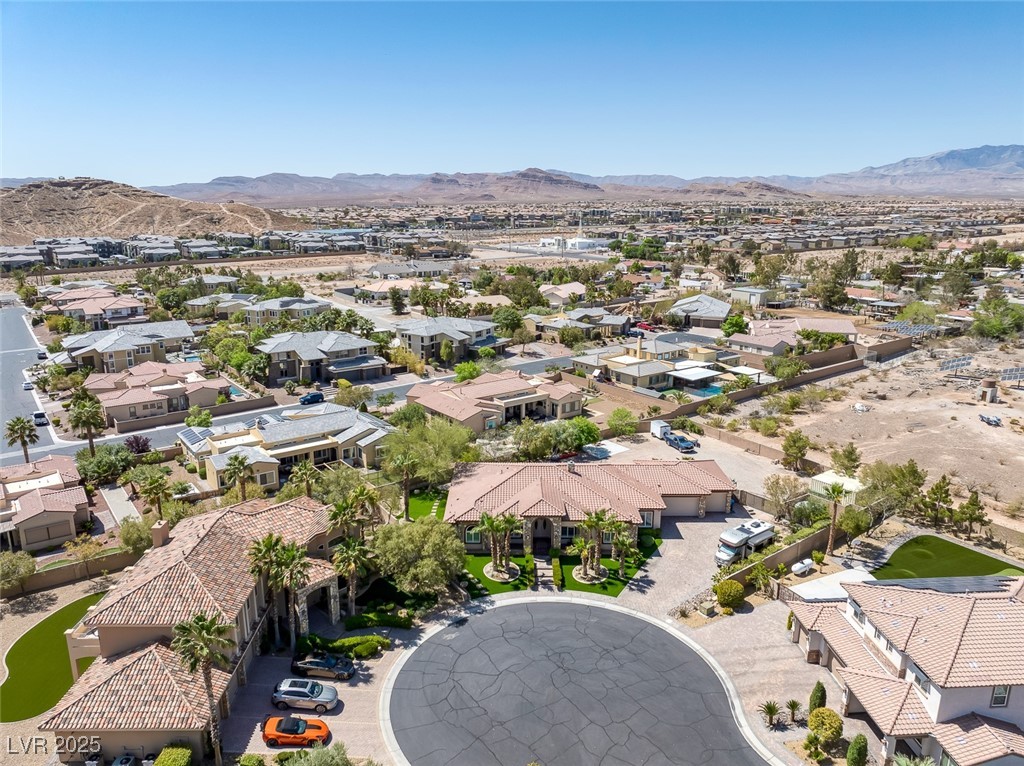 7687 West Pebble Road Las Vegas, NV 89113 - Photo 43 of 79 Drone / aerial view with a residential view and a mountain view