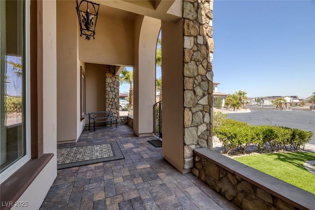 7687 West Pebble Road Las Vegas, NV 89113 - Photo 60 of 79 Property entrance featuring stone siding and stucco siding