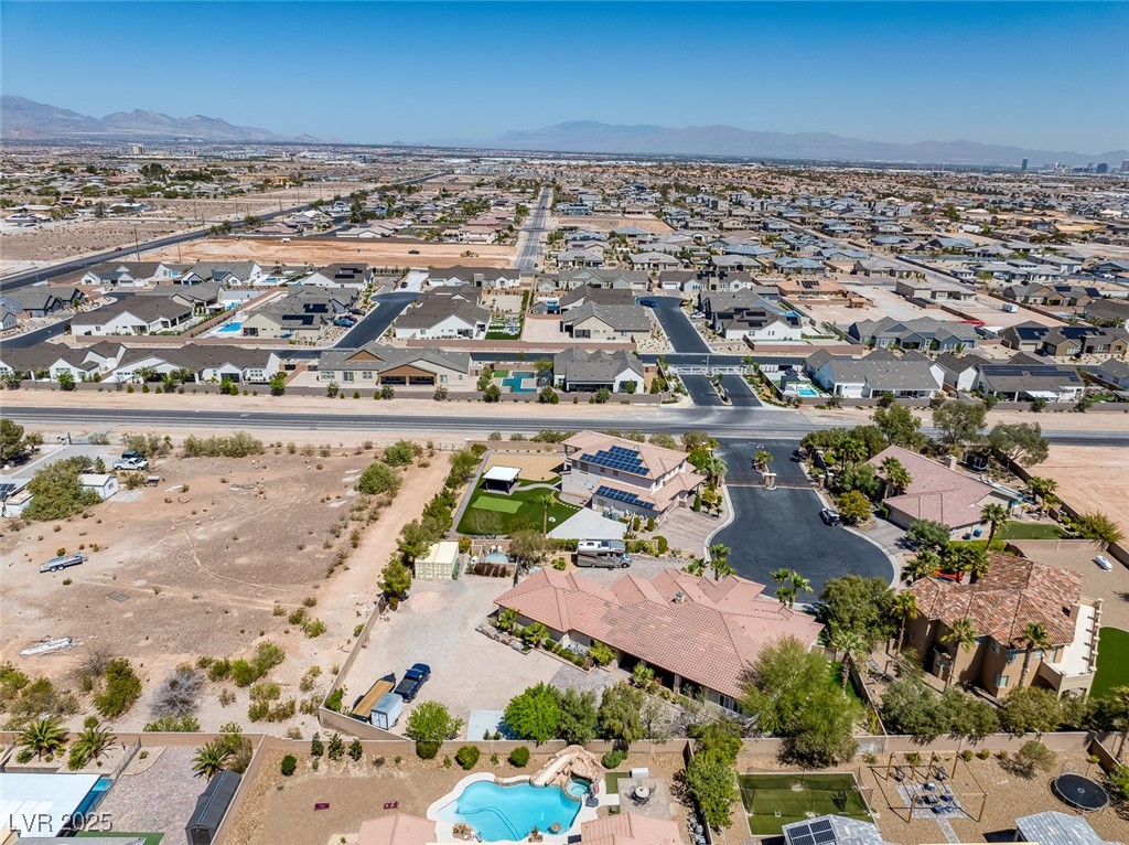 7687 West Pebble Road Las Vegas, NV 89113 - Photo 76 of 79 Birds eye view of property featuring a residential view and a mountain view