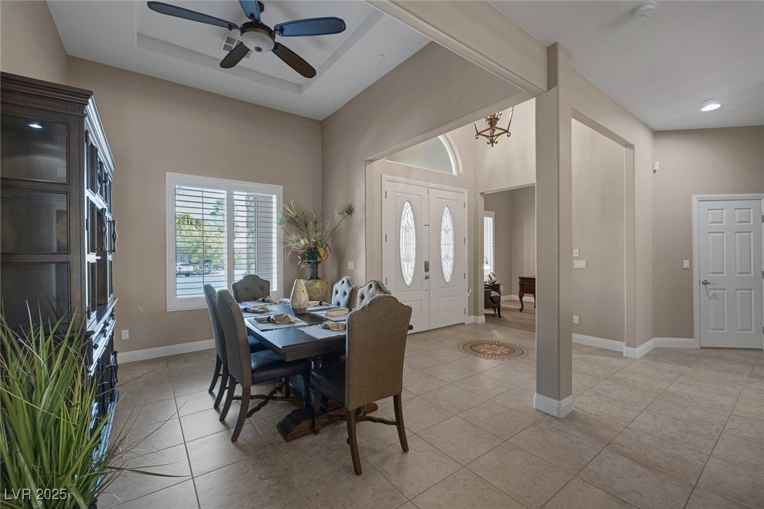 7687 West Pebble Road Las Vegas, NV 89113 - Photo 8 of 79 Dining area with light tile patterned floors, ceiling fan, baseboards, and recessed lighting