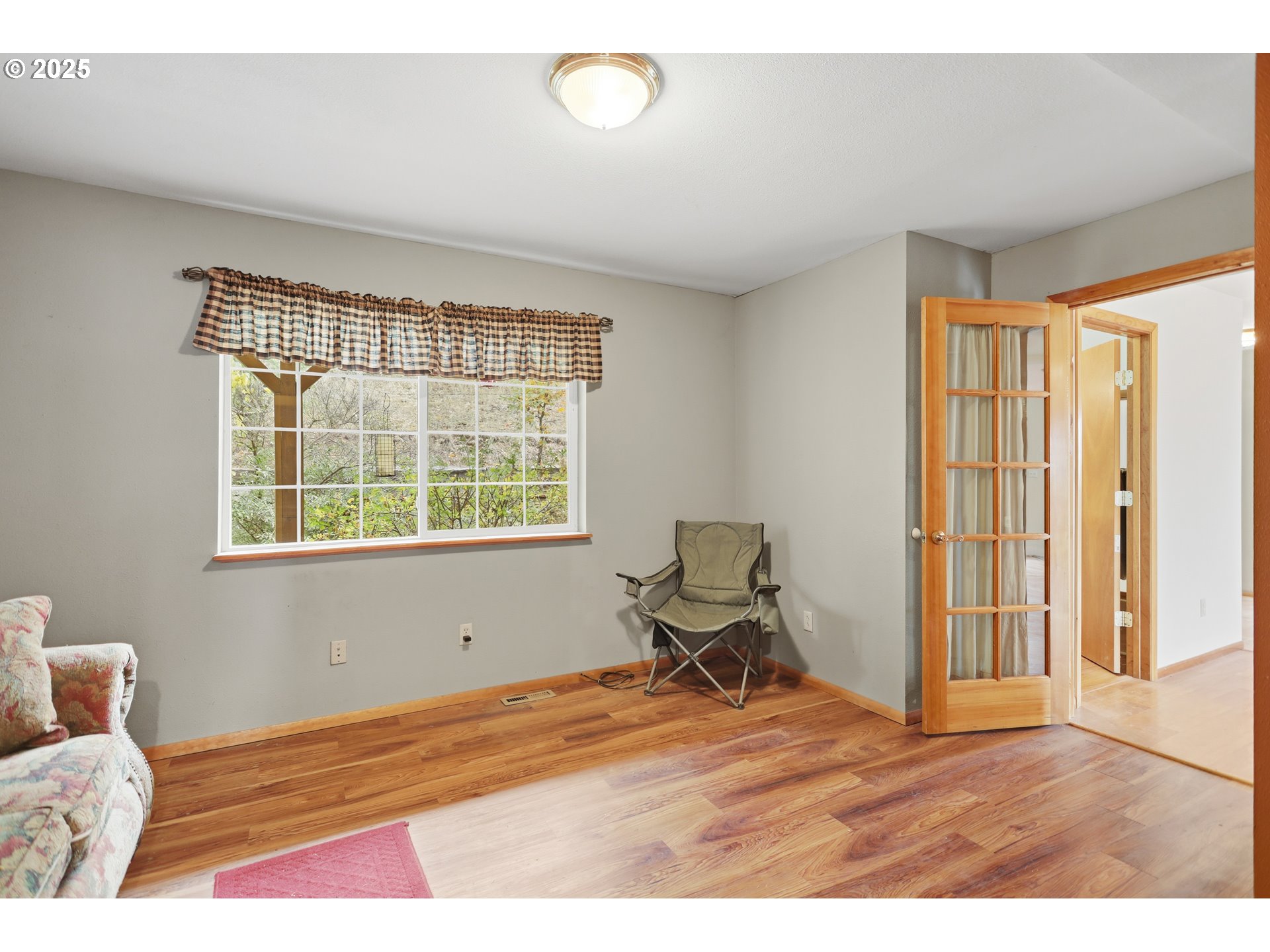2224 Foster Place Goldendale, WA 98620 - Photo 19 of 45 a bedroom with a bed and wooden floor