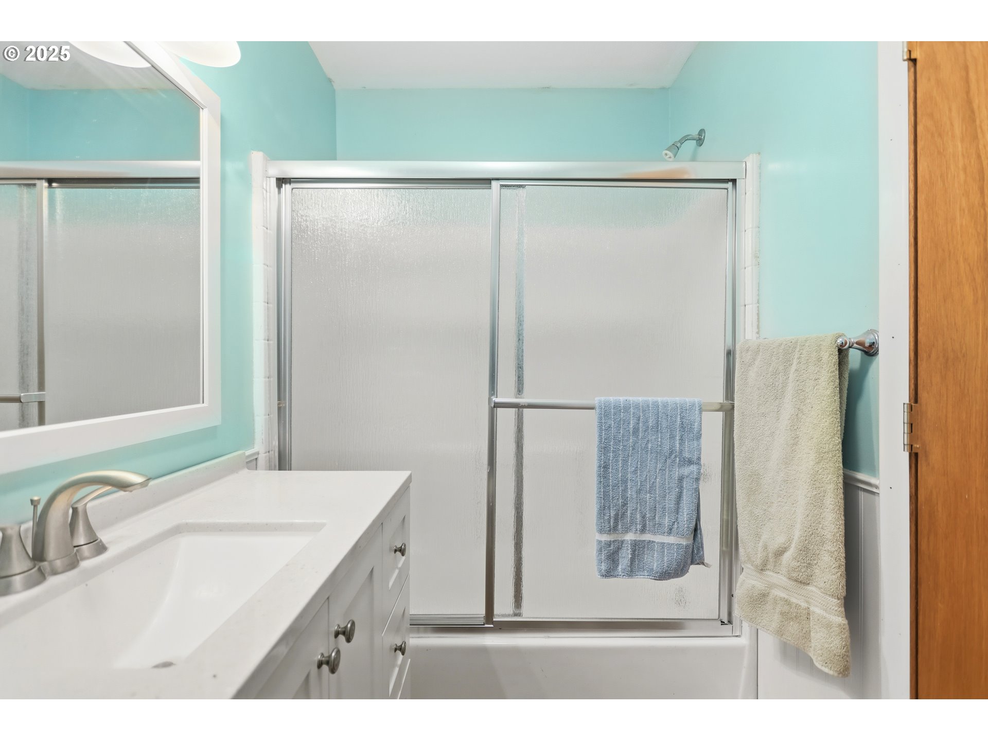 2224 Foster Place Goldendale, WA 98620 - Photo 22 of 45 a bathroom with a granite countertop shower sink vanity and mirror