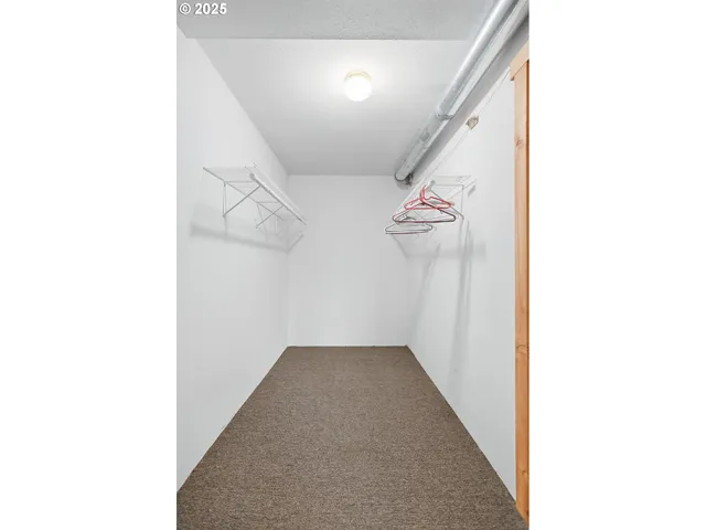 a view of a hallway with windows