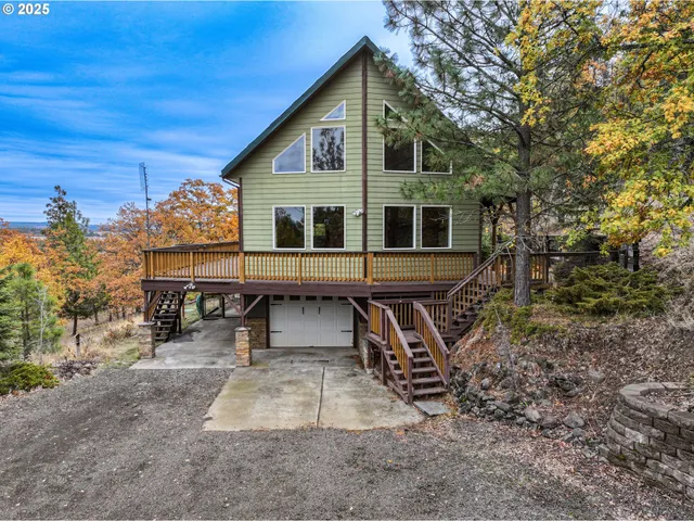 a view of a house with backyard porch and sitting area