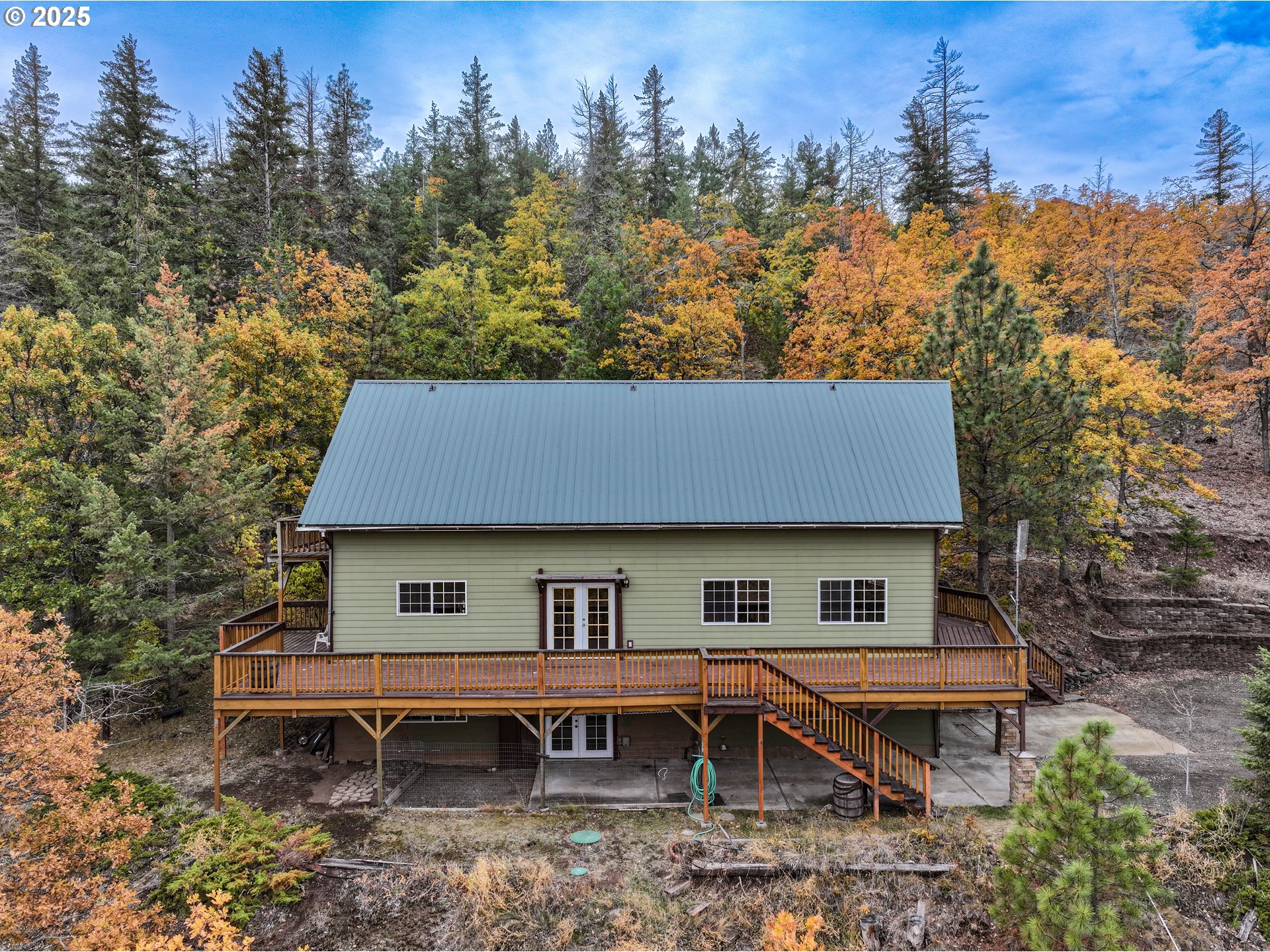 2224 Foster Place Goldendale, WA 98620 - Photo 5 of 45 an aerial view of a house and a yard table and chairs