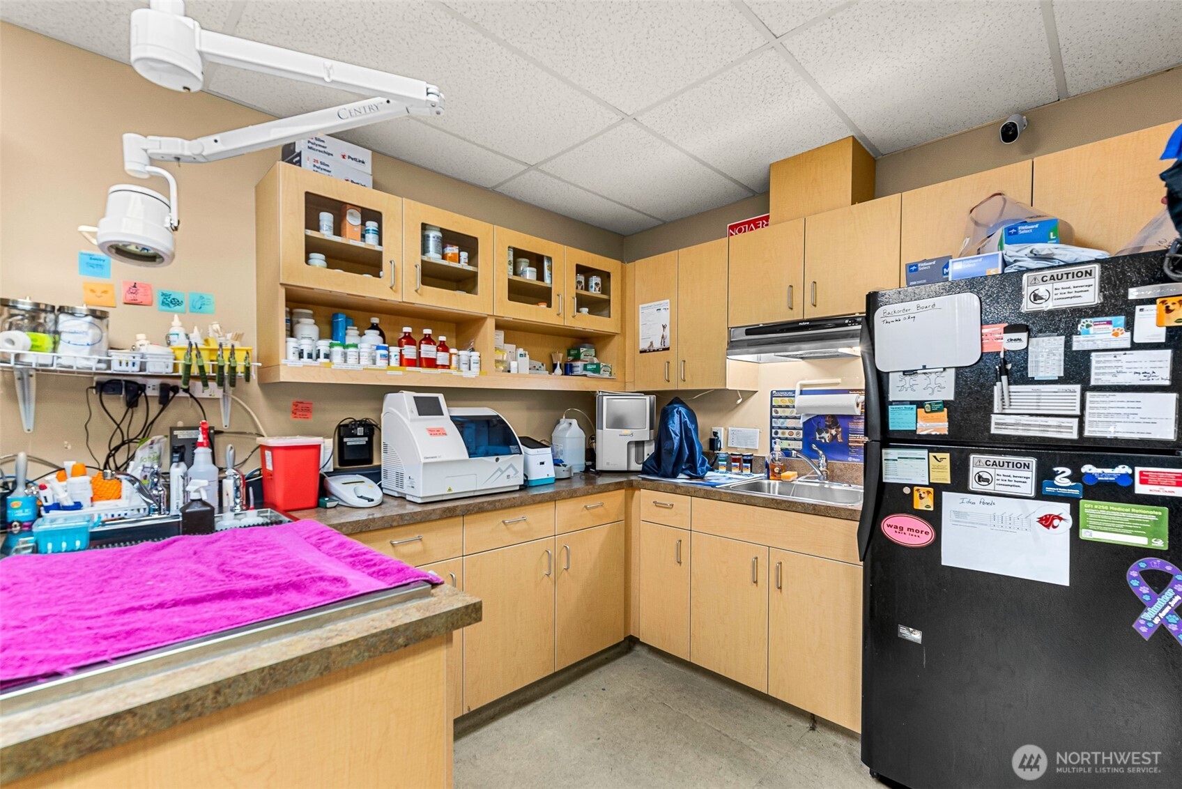 10 North Chelan Avenue Wenatchee, WA 98801 - Photo 22 of 40 a kitchen with lots of clutter and stainless steel appliances