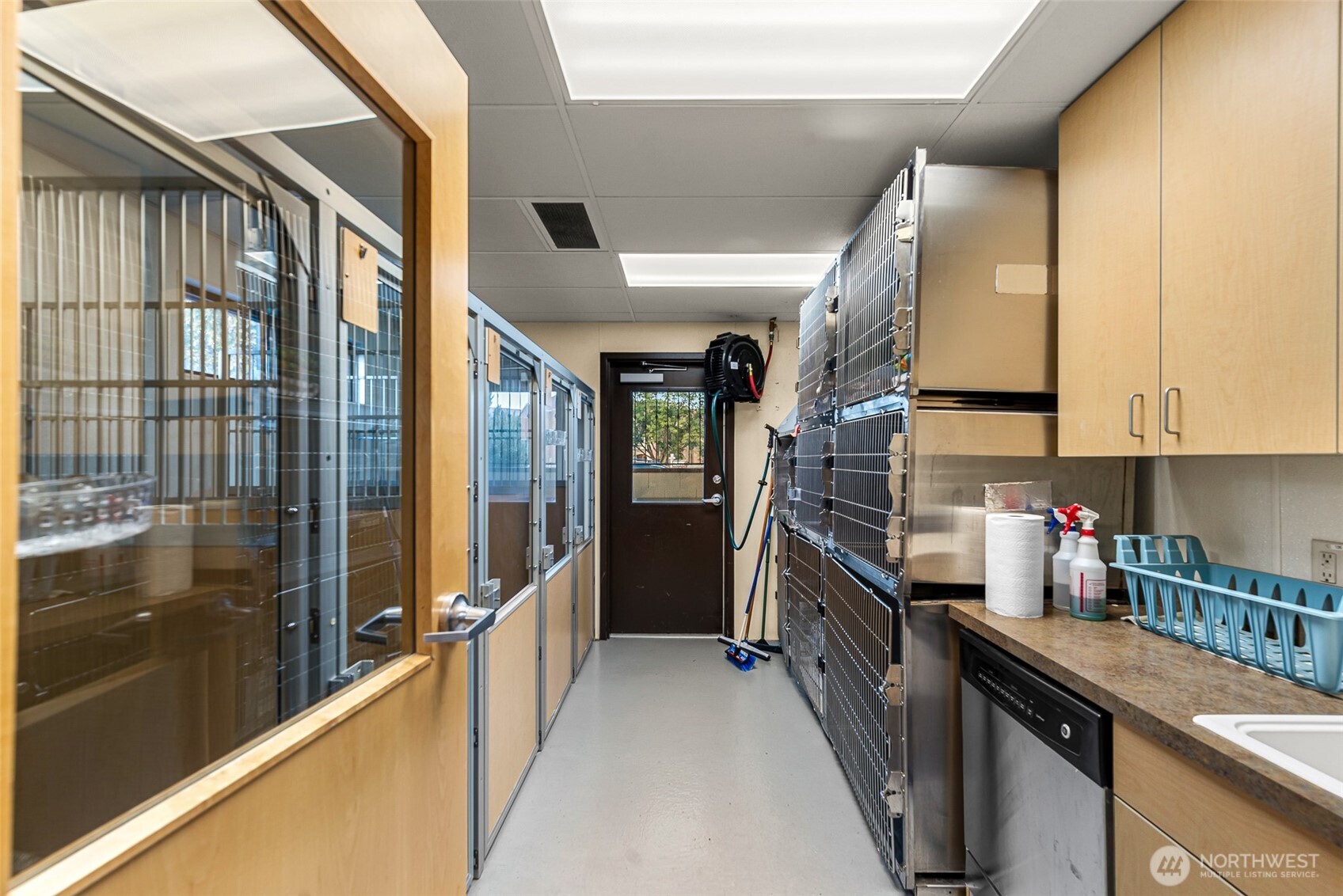 10 North Chelan Avenue Wenatchee, WA 98801 - Photo 36 of 40 a kitchen with stainless steel appliances granite countertop a refrigerator a stove and a sink