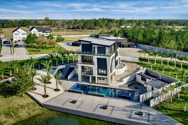 an aerial view of residential houses with outdoor space