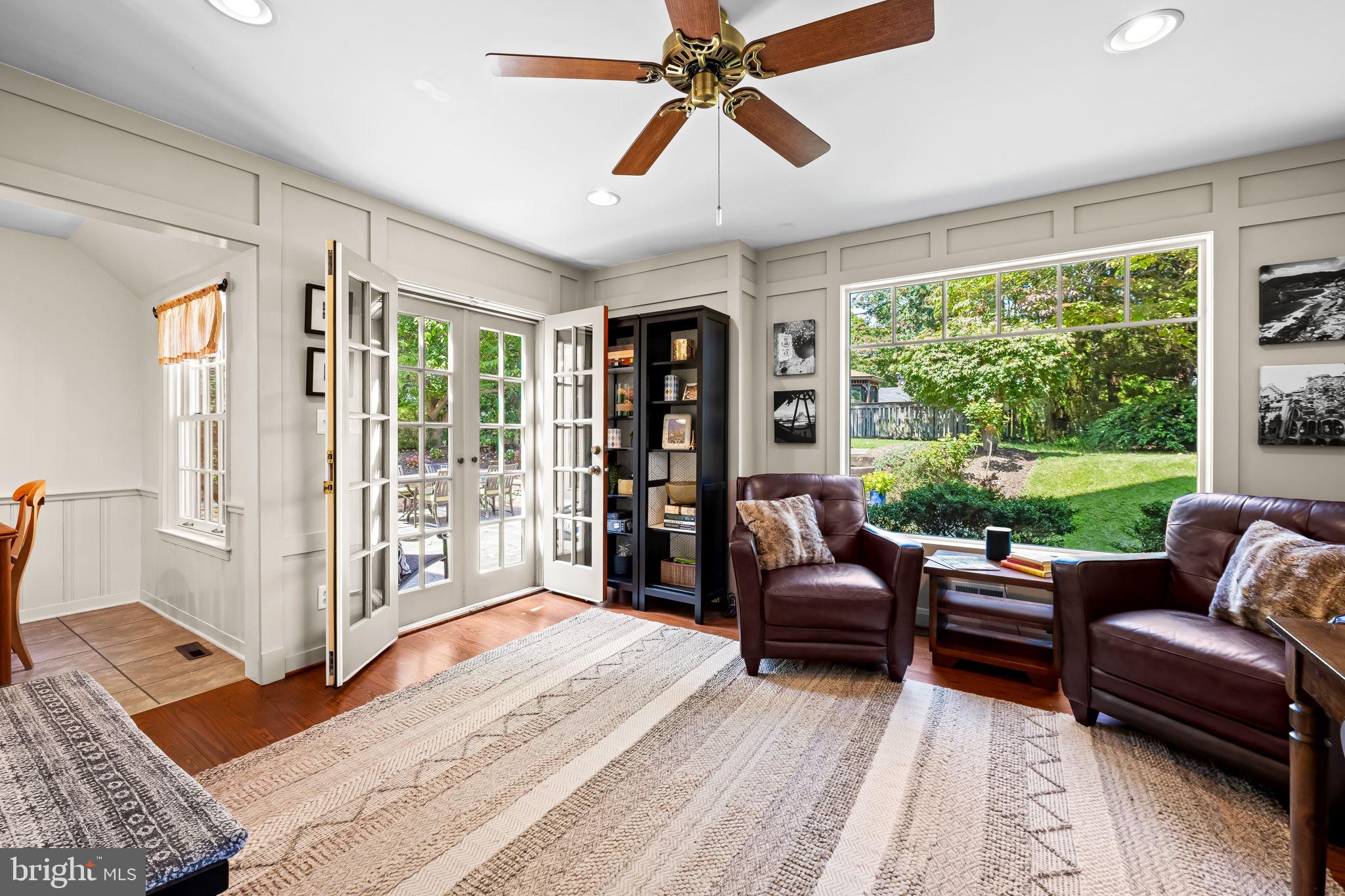 608 Worcester Road Baltimore, MD 21286 - Photo 13 of 49 a living room with furniture and a floor to ceiling window