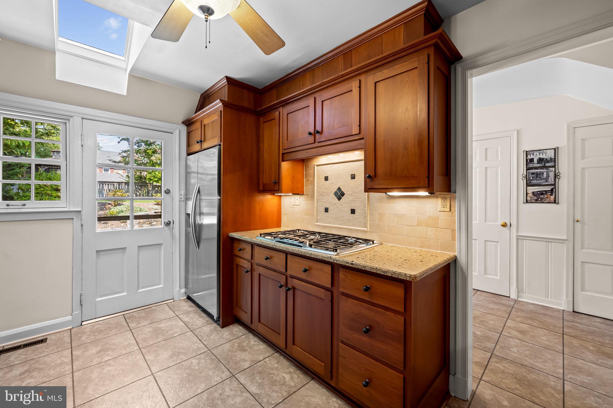 608 Worcester Road Baltimore, MD 21286 - Photo 18 of 49 a kitchen with stainless steel appliances granite countertop a stove and a refrigerator