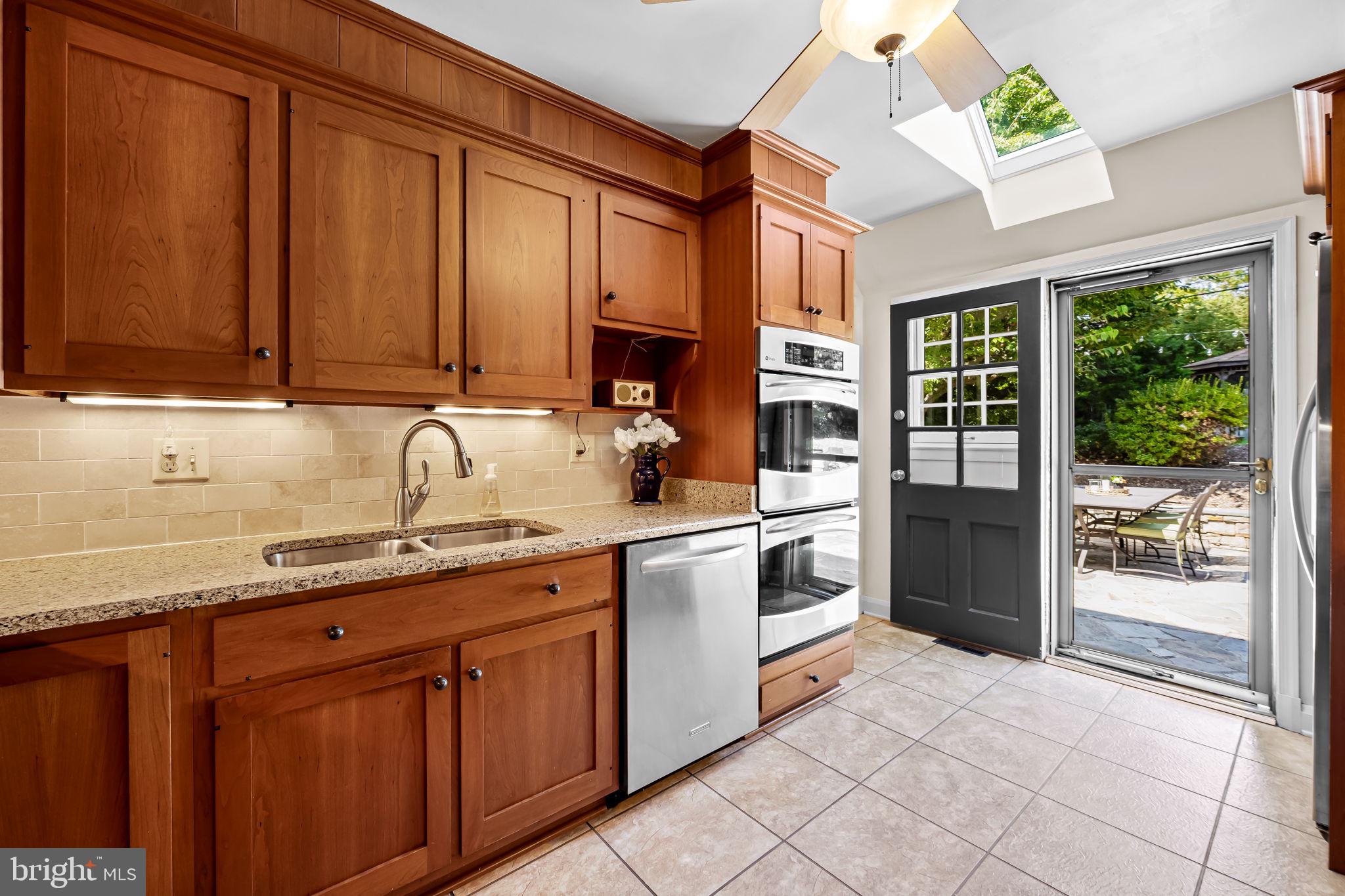608 Worcester Road Baltimore, MD 21286 - Photo 19 of 49 a kitchen with stainless steel appliances granite countertop a refrigerator and a sink