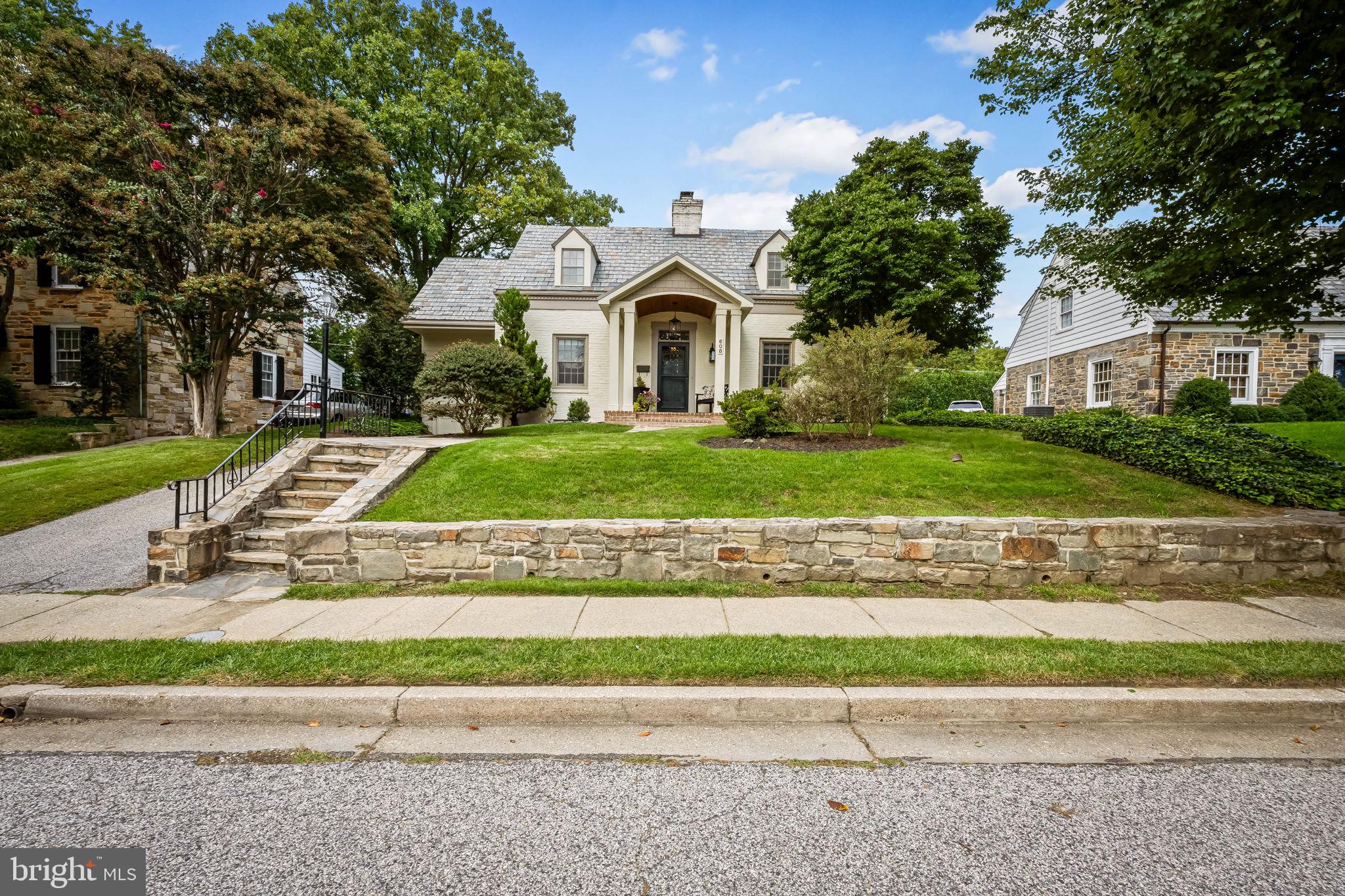 608 Worcester Road Baltimore, MD 21286 - Photo 2 of 49 a front view of a house with a yard