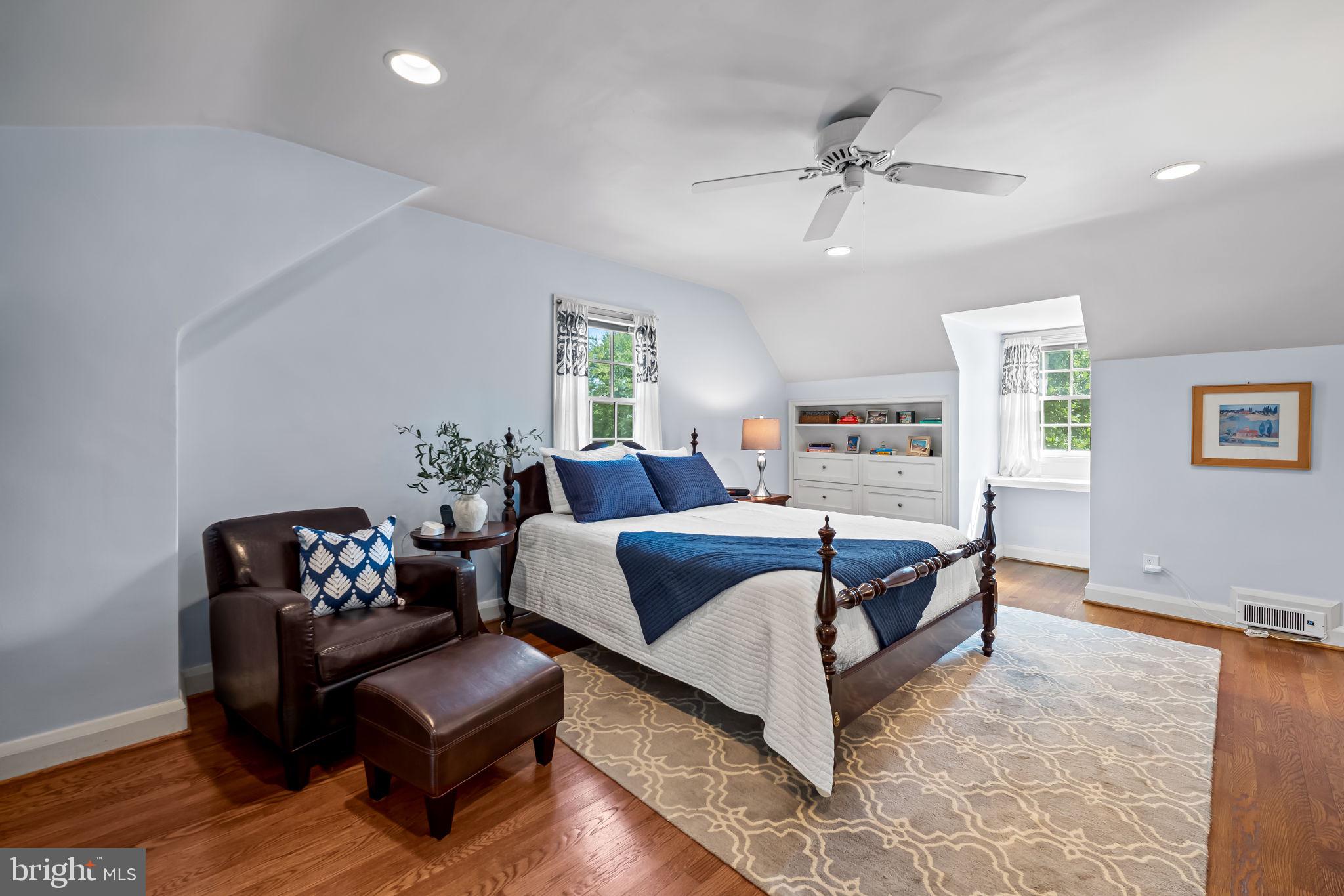 608 Worcester Road Baltimore, MD 21286 - Photo 25 of 49 a bedroom with a bed couch and window