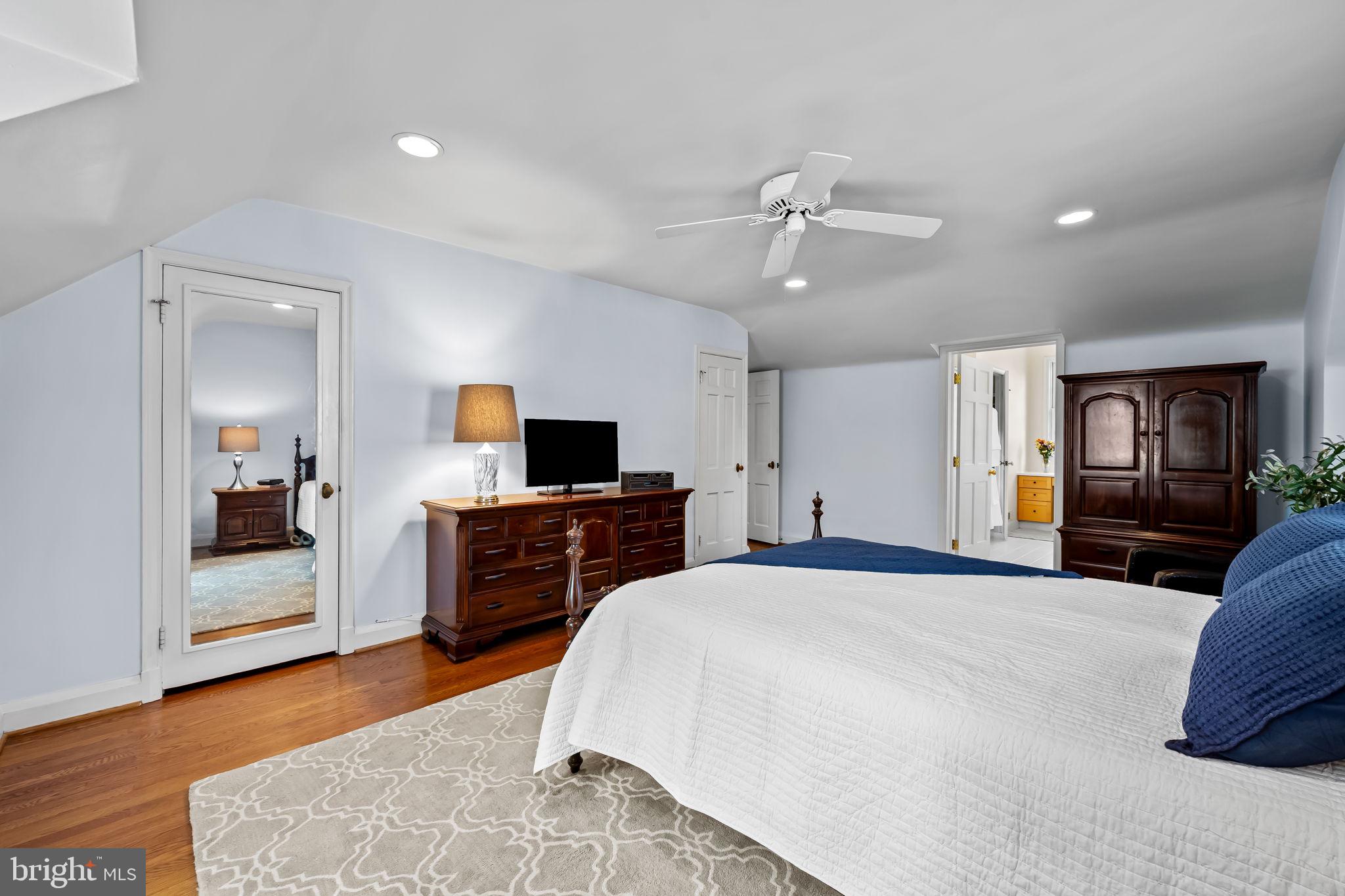 608 Worcester Road Baltimore, MD 21286 - Photo 26 of 49 a bedroom with a bed and a television