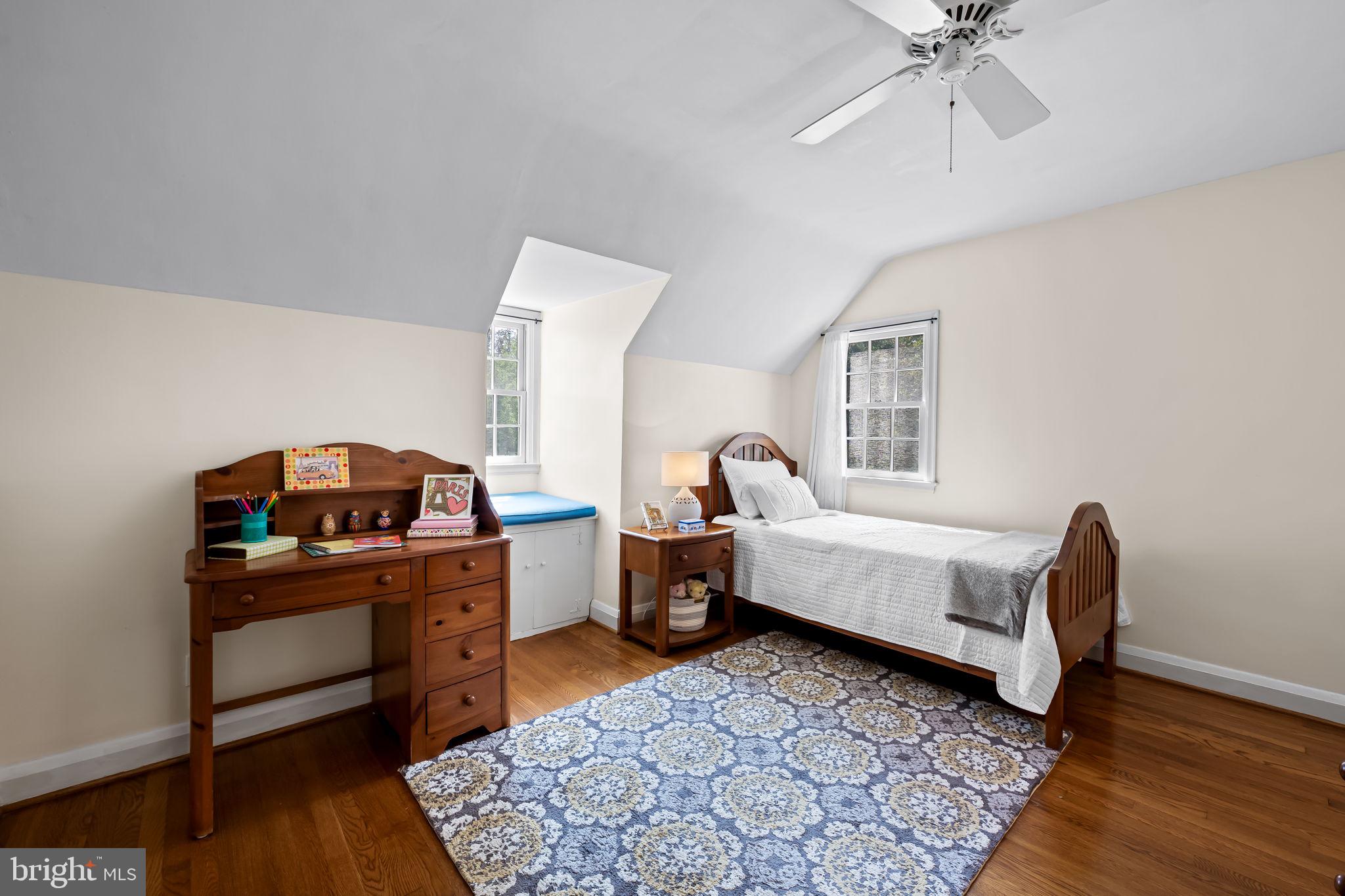 608 Worcester Road Baltimore, MD 21286 - Photo 30 of 49 a bedroom with furniture and a wooden floor