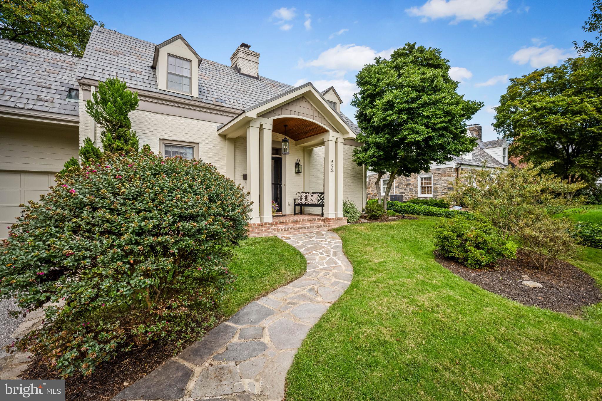 608 Worcester Road Baltimore, MD 21286 - Photo 3 of 49 a front view of a house with garden