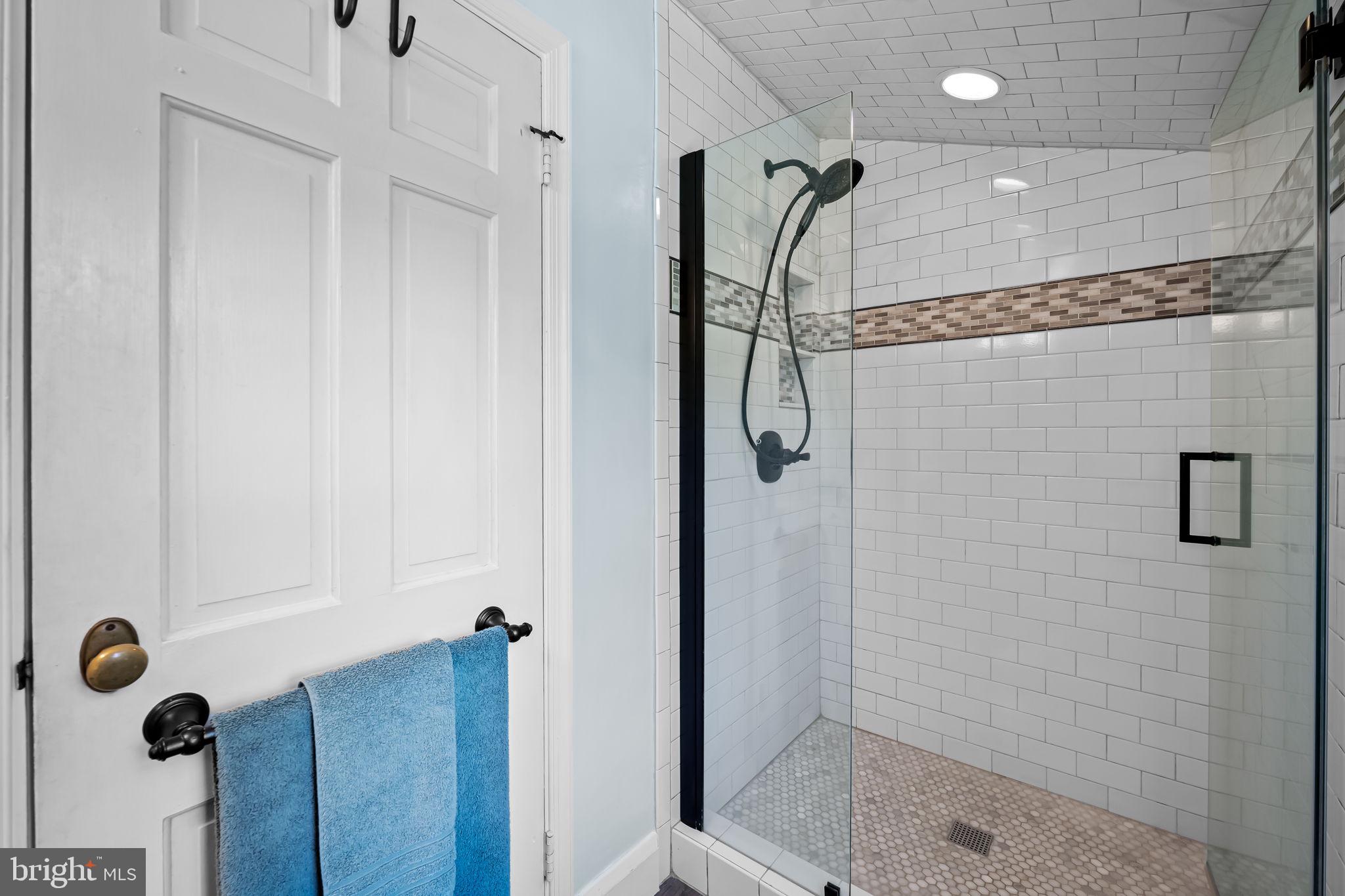 608 Worcester Road Baltimore, MD 21286 - Photo 33 of 49 a bathroom with a shower