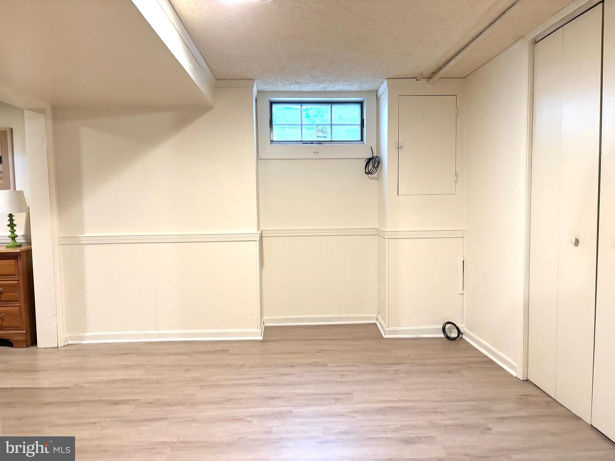 608 Worcester Road Baltimore, MD 21286 - Photo 39 of 49 a view of a room with wooden floor and a window