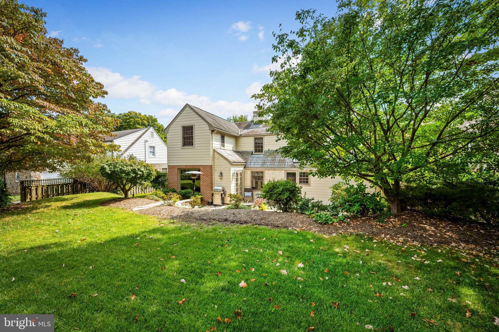 608 Worcester Road Baltimore, MD 21286 - Photo 40 of 49 a front view of a house with a yard and trees