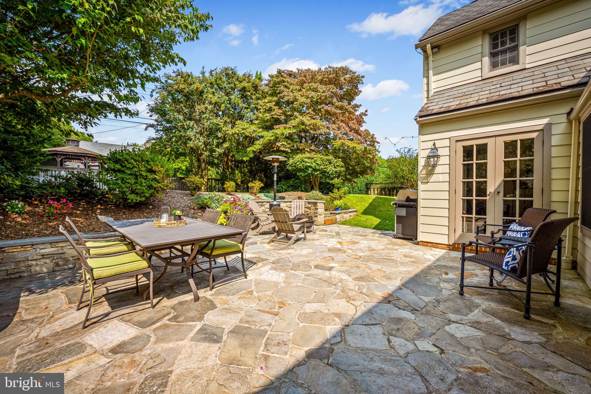 608 Worcester Road Baltimore, MD 21286 - Photo 41 of 49 a view of a patio with table and chairs and potted plants