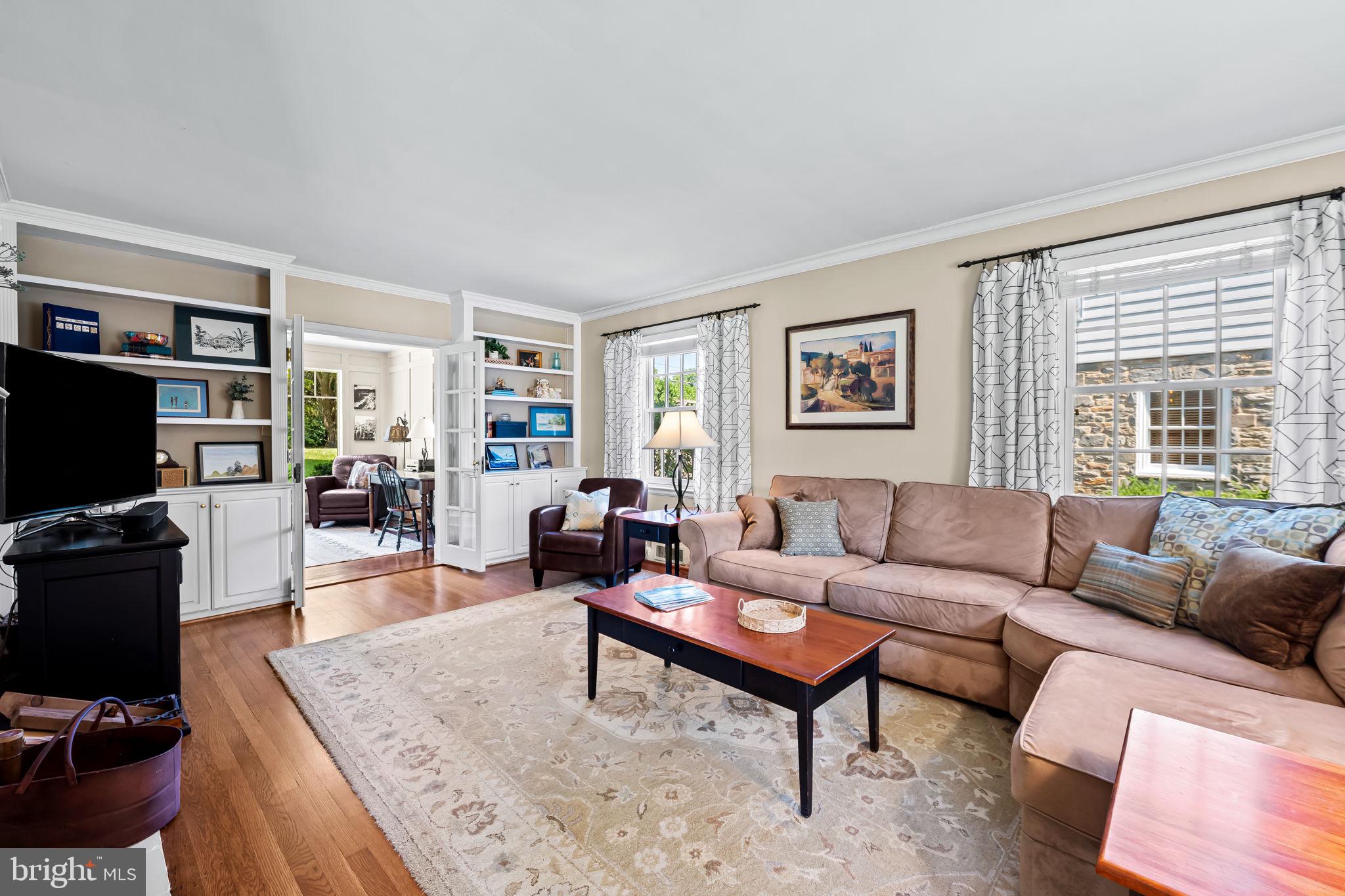 608 Worcester Road Baltimore, MD 21286 - Photo 10 of 49 a living room with furniture a rug and a flat screen tv