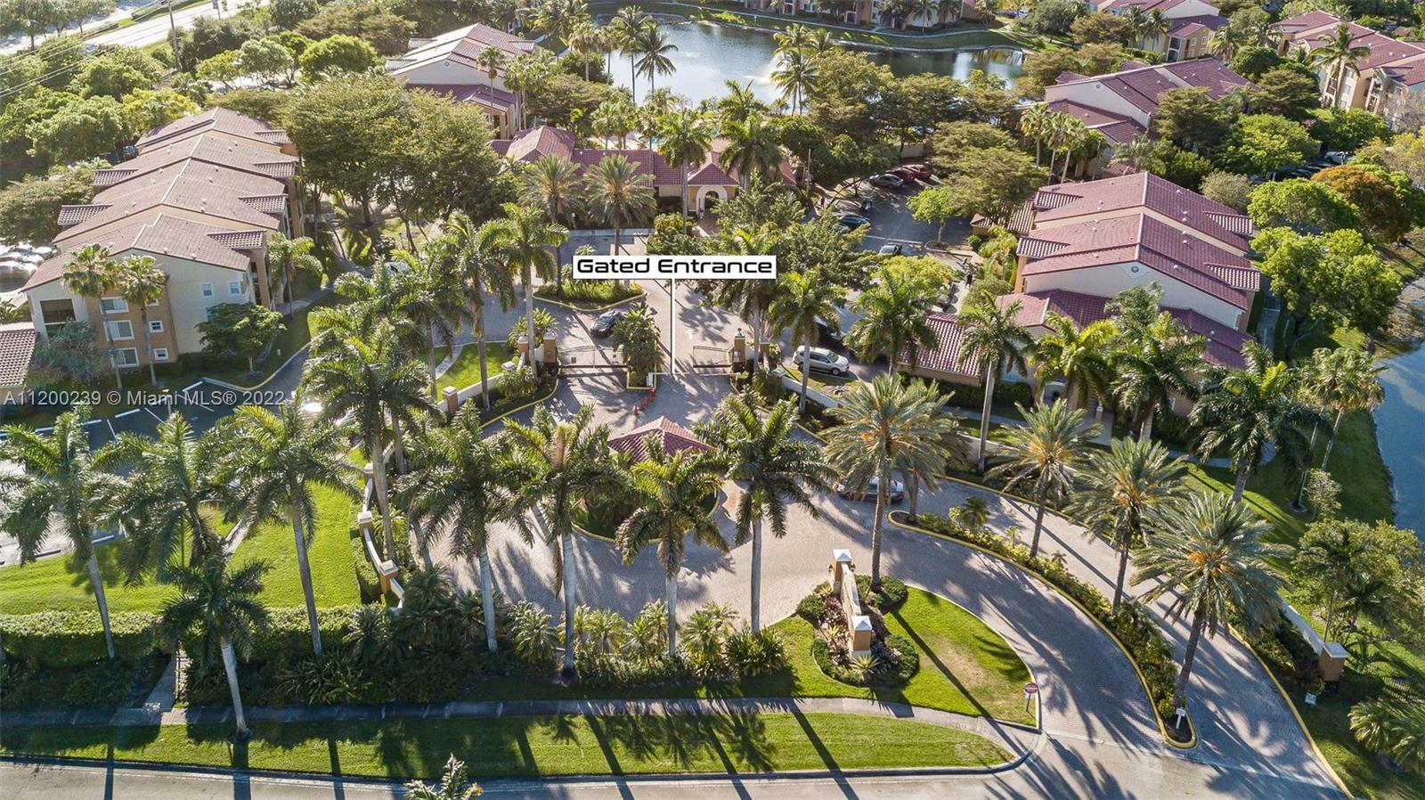 2071 Renaissance Boulevard, Unit 203 Miramar, FL 33025 - Photo 14 of 17 a view of a yard with plants and large trees