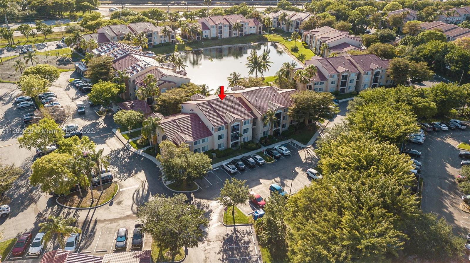 2071 Renaissance Boulevard, Unit 203 Miramar, FL 33025 - Photo 17 of 17 an aerial view of a house with a yard and garden space