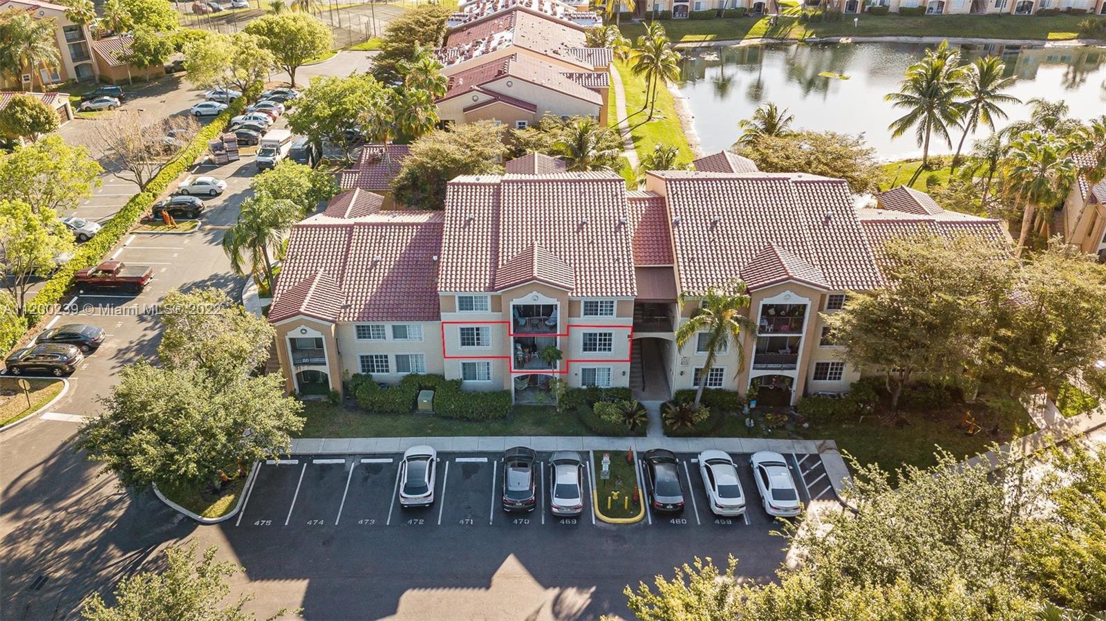 2071 Renaissance Boulevard, Unit 203 Miramar, FL 33025 - Photo 2 of 17 an aerial view of house with yard swimming pool and outdoor seating