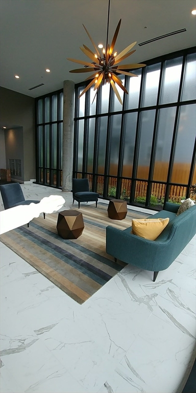 22 Mechanic Street, Unit 507 Quincy, MA 02169 - Photo 11 of 21 a bathroom with a sink and a mirror