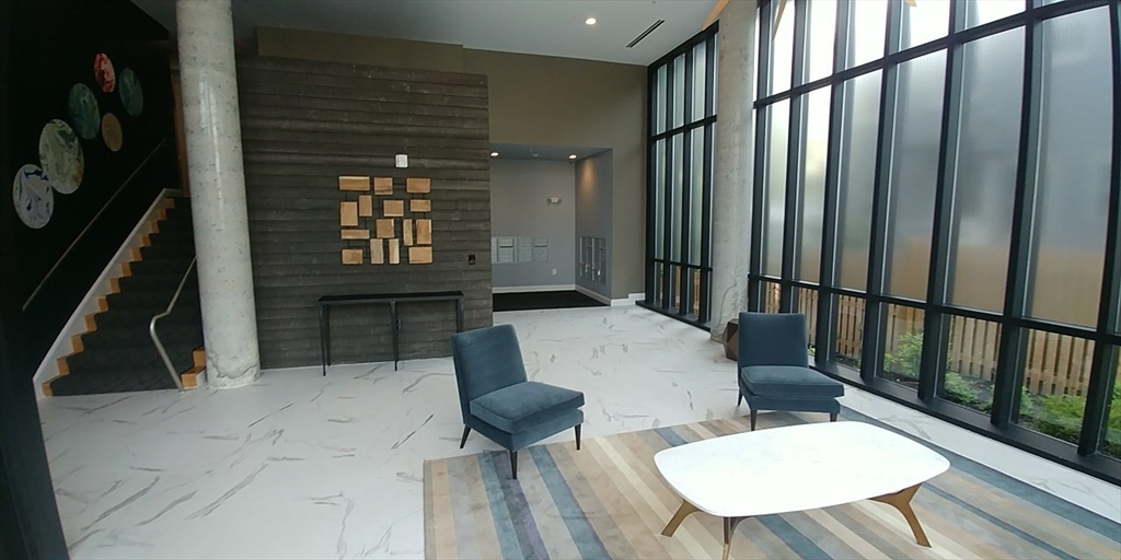 22 Mechanic Street, Unit 507 Quincy, MA 02169 - Photo 13 of 21 a view of a chairs and table in the balcony
