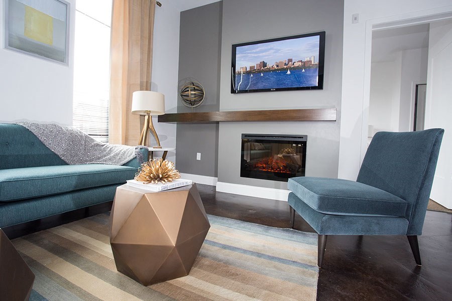 22 Mechanic Street, Unit 507 Quincy, MA 02169 - Photo 6 of 21 a living room with furniture and a fireplace