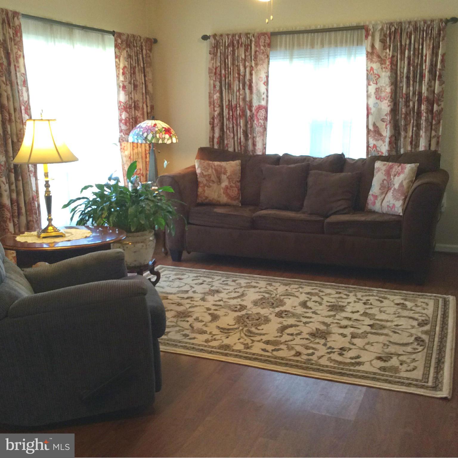 229 Baltimore Street Aberdeen, MD 21001 - Photo 2 of 24 a living room with furniture and a large window