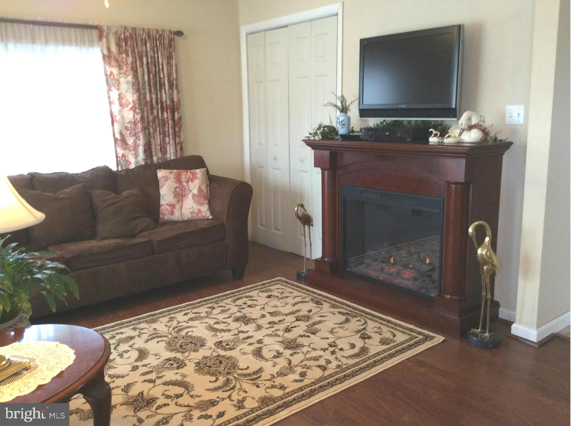 229 Baltimore Street Aberdeen, MD 21001 - Photo 3 of 24 a living room with furniture and a fireplace