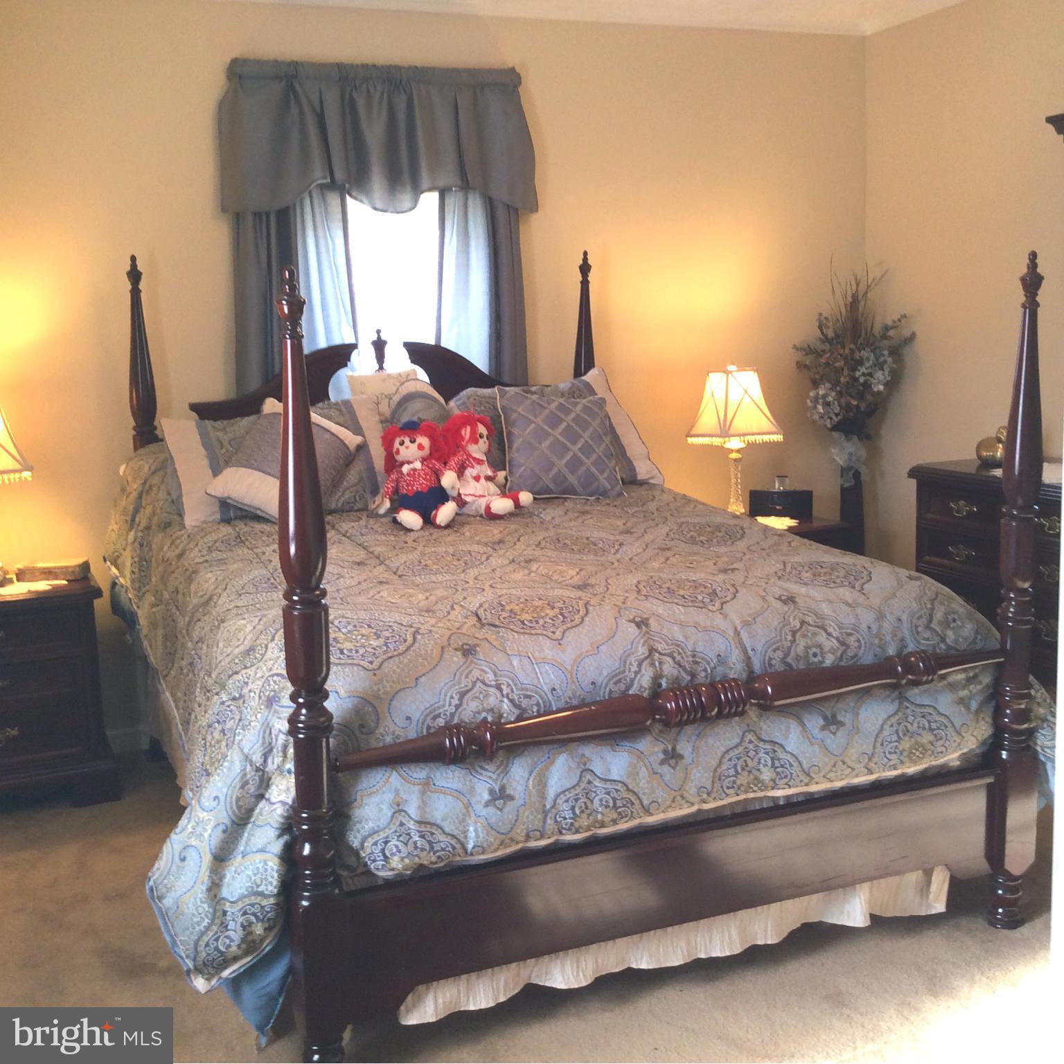 229 Baltimore Street Aberdeen, MD 21001 - Photo 7 of 24 a bedroom with a bed and a window