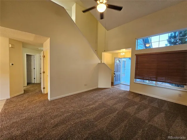 a view of empty room with a fireplace