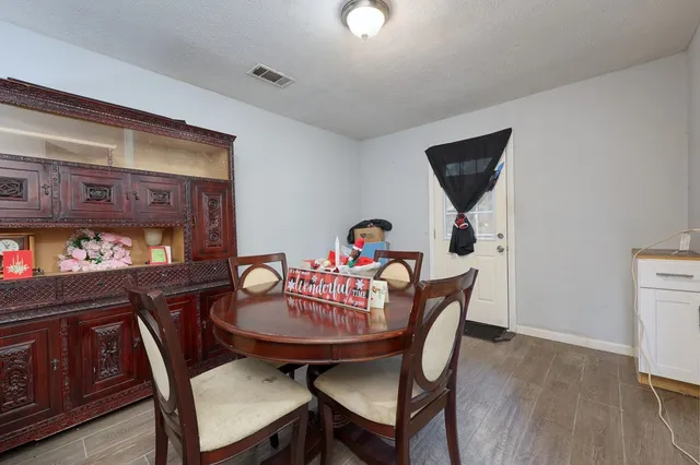 a dining room with furniture and window