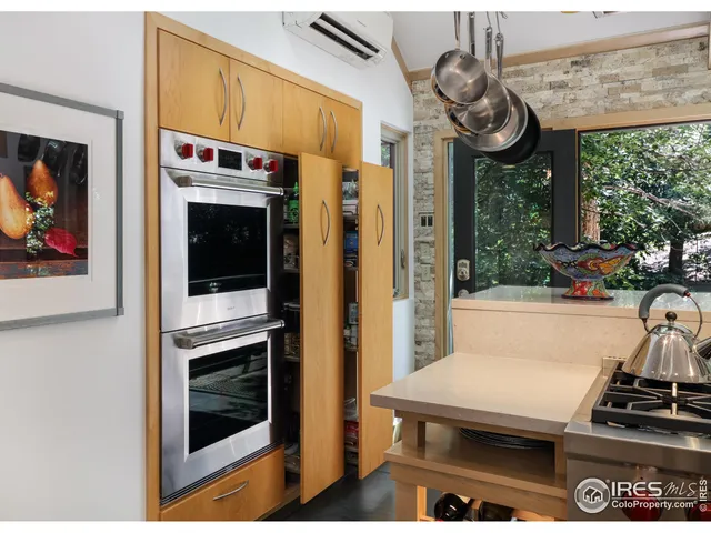 a kitchen with a refrigerator and a sink