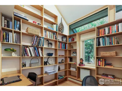 a bedroom with a bed and a night stand