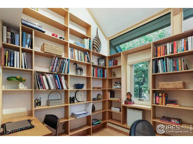 a bedroom with a bed and a night stand