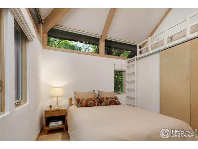 a bathroom with a sink a toilet a mirror and shower