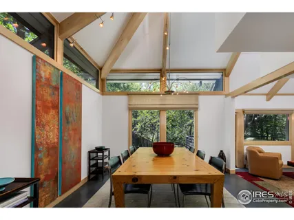 a view of a room with furniture and window